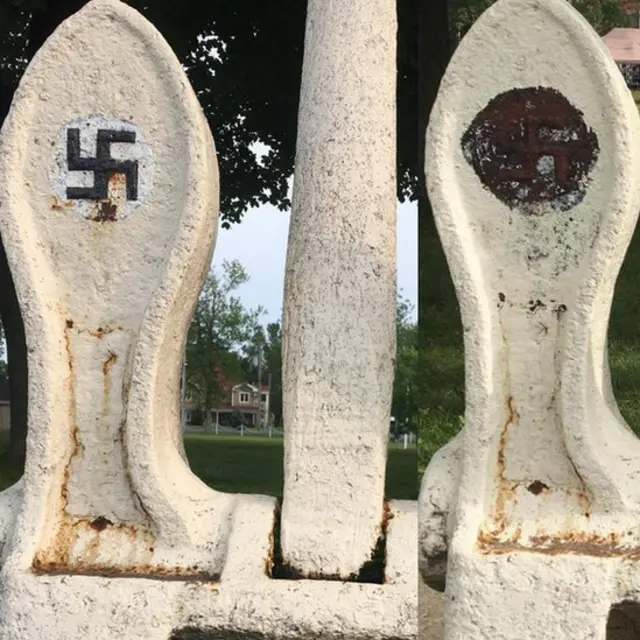 Anchor with swastikas partially painted over