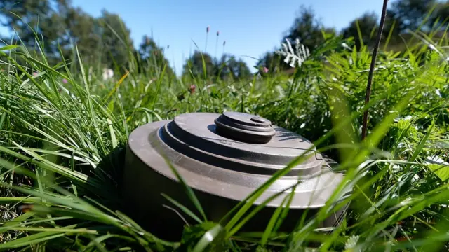 A mine on a grass field