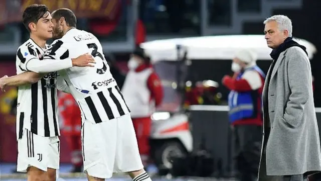 Juventus players Paulo Dybala and Giorgio Chiellini celebrate in front of Jose Mourinho during Roma's recent 4-3 home defeat in Serie A