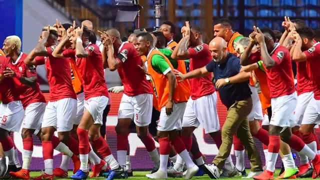 Les joueurs de l'équipe nationale de football de Madagascar célébrant leur victoire