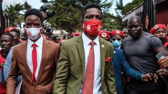 Ugandan singer turned politician Robert Kyagulanyi (C) aka Bobi Wine arrives to the headquarters of his new political party National Unity Platform (NUP) as he is nominated as President of the party in Kampala, Uganda, on August 21, 2020. - Kyagulanyi plans to run for President in 2021 elections against the incumbent President Yoweri Museveni who has been in power for 32 years.