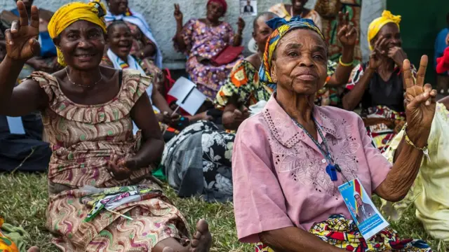 Supporters of opposition leader Etienne Tshiskedi sit on the ground as they gather for a rally to welcome him in the surroundings of his residence in Kinshasa, DR Congo - Wednesday 27 July 2016