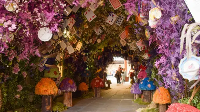 Alice in Wonderland themed flower display is seen in Duke Of York Square