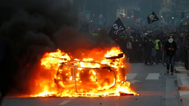 A car burns during during clashes with police at a demonstration of the "yellow vests" movement in Marseille, France, December 8, 2018.