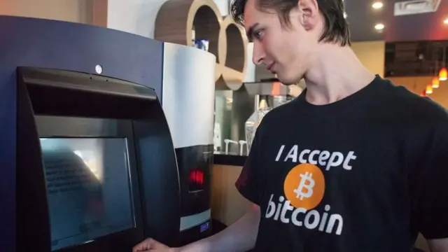 Di world first Bitcoin ATM cash machine dey launched for Canada in 2013.