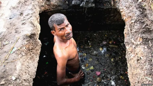 Workers Cleaning Sewer