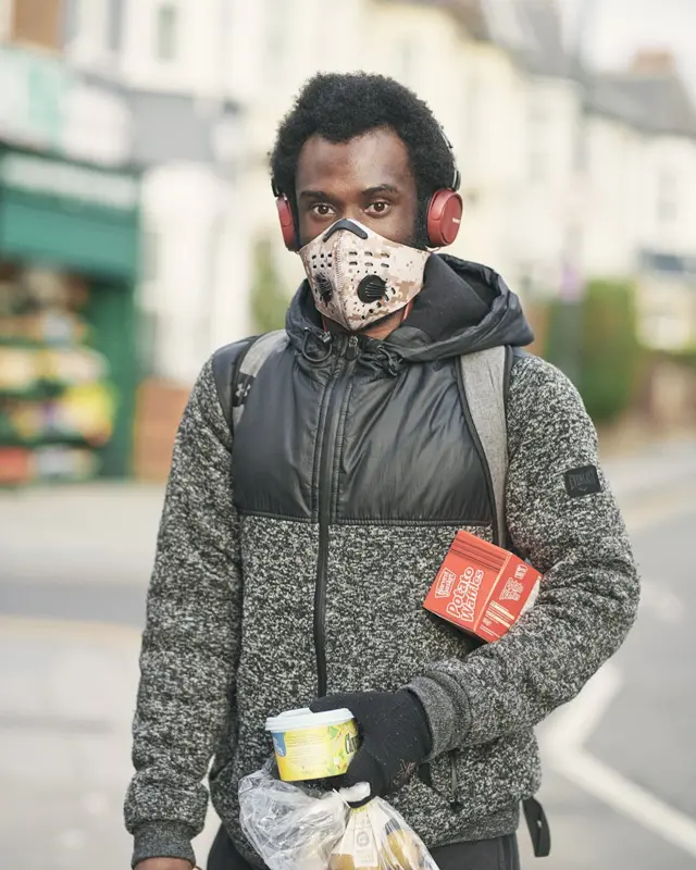 Man in a mask with his shopping