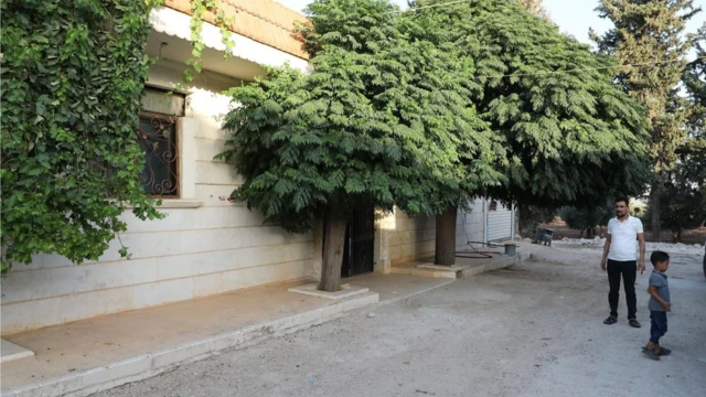 Khalil outside im new house wit im boy