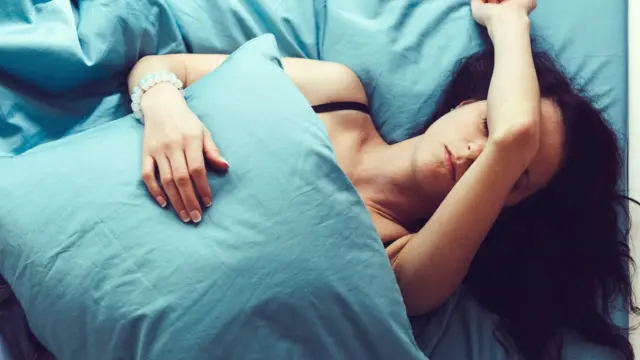 Woman struggling to sleep