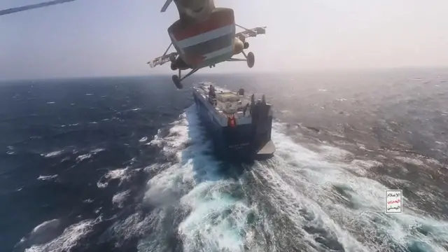 This handout screen grab captured from a video shows Yemen's Houthi fighters' takeover of the Galaxy Leader Cargo in the Red Sea coast off Hudaydah, on 20 November 2023 in the Red Sea, Yemen.