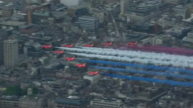 Di Red Arrows roar over as di Queen watched wit big smile on her face