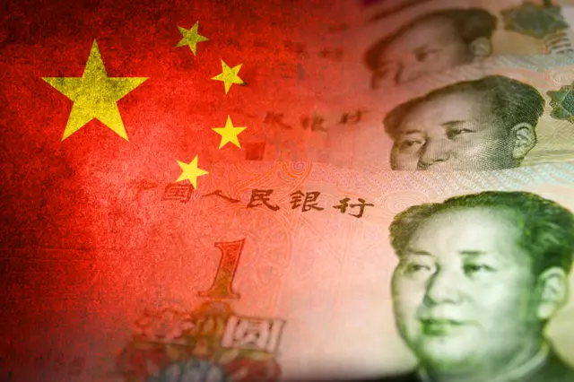 Chinese yuan cash bills and chinese flag