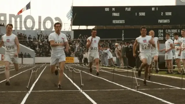 Sprinters run in line for scene from Chariots of Fire