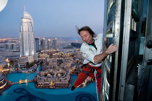 MARCH 28: (FRANCE OUT) Alain Robert, known as the French "Spiderman" climbs the highest building in the world, Burj Khalifa on March 28, 2011 in Dubai, United Arab Emirates. Unlike many of Robert's recent climbs the ascent of the 828 metres (2,717 feet) tower was made using rope and harness as security precautions and received official recognition in marking the holding of the event 10th 'Education Without Borders'.