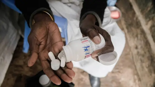 A woman taking medicine