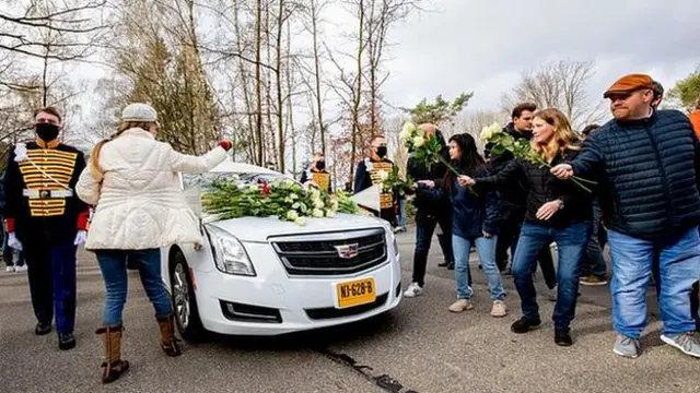 Mourners line the streets during Mentel-Spee's funeral ceremony