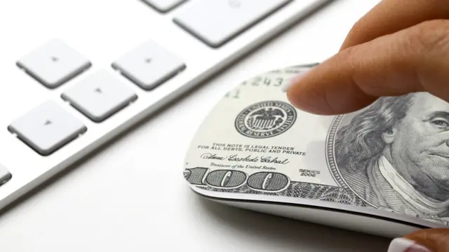 Ratón con el símbolo del dólar.