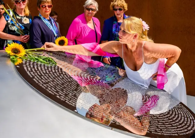 Relatives attend a commemoration ceremony in memory of the victims of the Malaysia Airlines flight MH17 plane crash