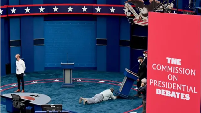 A worker inspects the debate stage