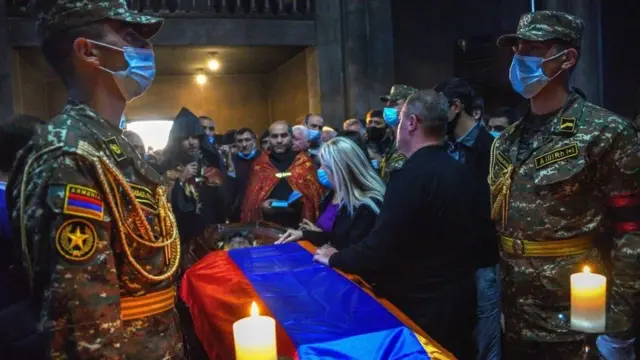 People attend a funeral service of an Armenian soldier who died in recent military clashes between Armenia and Azerbaijan