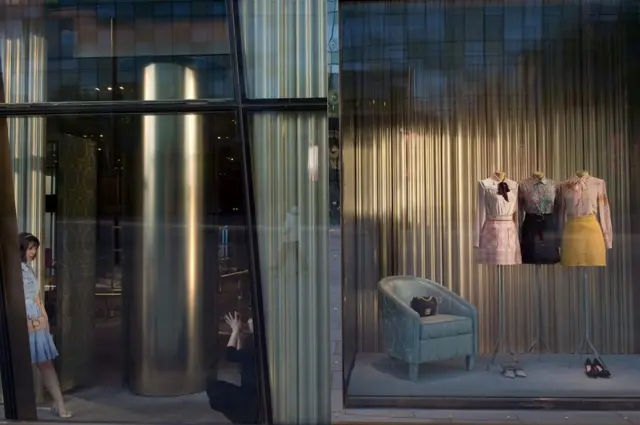 Woman in a shop window