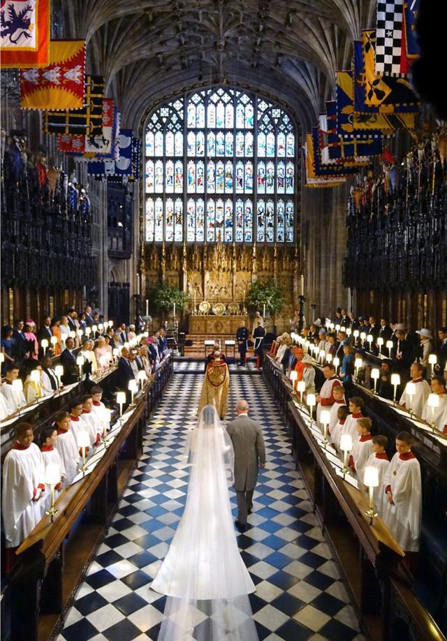 Prince of Wales walking Meghan Markle up the aisle of St George's Chapel at Windsor Castle