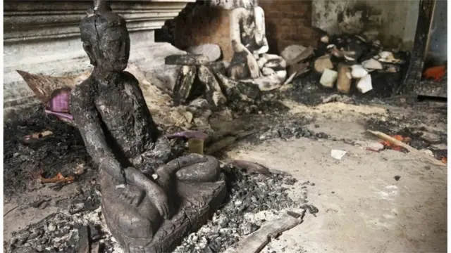 আট বছর আগে ধর্ম অবমাননার গুজবে কক্সবাজারের রামুতে বৌদ্ধ পল্লীতে হামলায় ১৩টি বৌদ্ধ মন্দিরে আগুন দিয়ে পোড়ানো হয়েছিল।