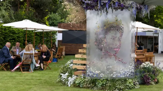 A display depicting an image of Britain's Queen Elizabeth II, created ahead of her Platinum Jubliee, is pictured at the Veevers Carter garden at Chelsea Flower Show on May 23, 2022 in London, England. T