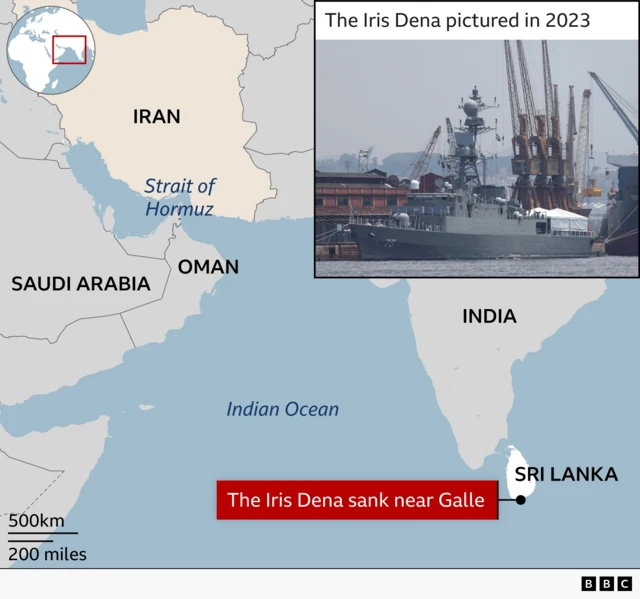 A map showing the Arabian Sea region including Iran, Oman, Saudi Arabia, India, and Sri Lanka. A red label near Sri Lanka marks the location where the Iris Dena sank near Galle. The Strait of Hormuz is labelled between Iran and Oman. In the upper-right corner, an inset photo shows a grey naval ship docked at a port with cranes in the background, labelled the Iris Dena in Brazil in 2023. A small world map in the upper-left highlights the region with a red rectangle.