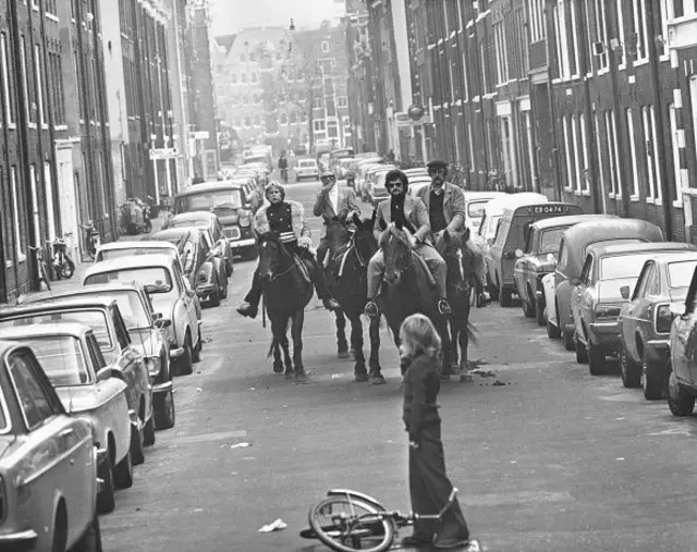 Four horsemen riding through the streets of Amsterdam on a 'motorless day', when cars are prohibited due to the oil crisis in the Middle East, 4th November 1973. (Photo by Keystone/Hulton Archive/Getty Images)