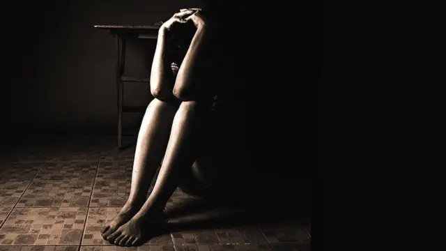 Woman sat on a floor