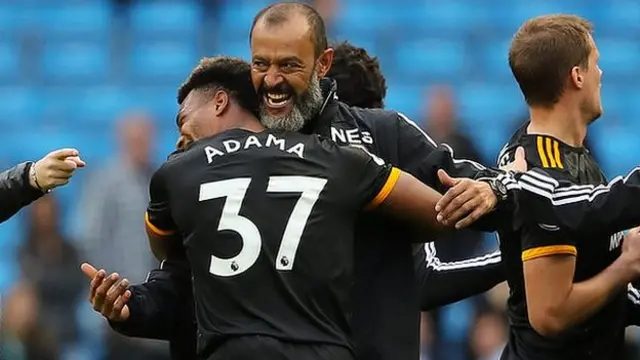 Adama Traore celebrates with Wolves boss Nuno Santo