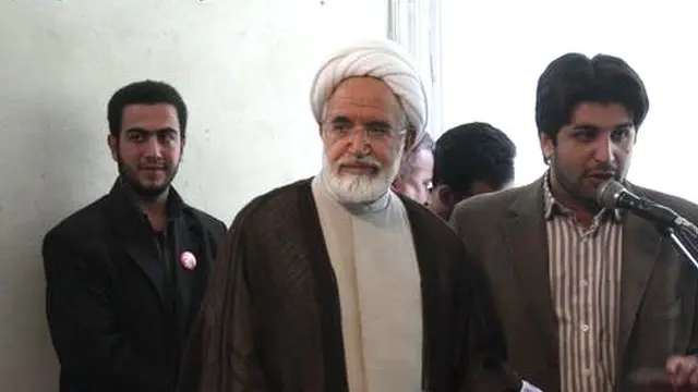 سعید قندهاری (راست) عضو حزب اعتماد ملی بود