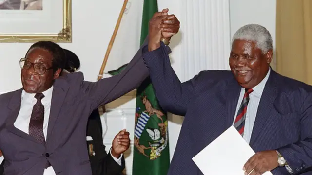 Robert Mugabe e Joshua Nkomo (22pokerstars promocoesdezembropokerstars promocoes1987)