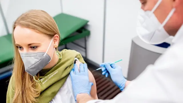Marie Rohlfs, teacher at the Sternschnuppe Kindergarten receives a dose of AstraZeneca"s vaccine against the coronavirus disease (COVID-19) from Thomas Holler in Bremen, Germany, February 26, 2021.