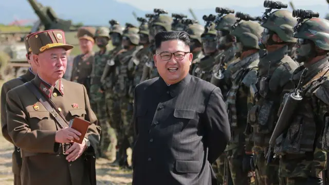 This undated photo released by North Korea's official Korean Central News Agency (KCNA) on August 26, 2017 shows North Korean leader Kim Jong-Un (C) presiding over a target strike exercise conducted by the special operation forces of the Korean People's Army (KPA) at an undisclosed location