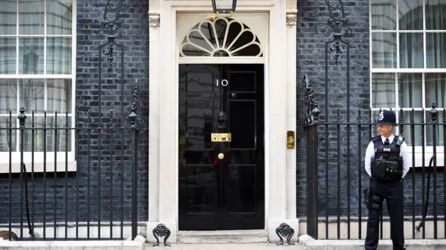 A policeman stands on guard outside No 10 Downing Street