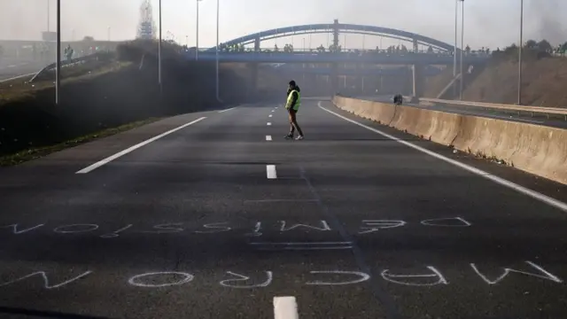 A man crosses an empty road in Caen, France