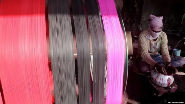 6. Preparation for the upcoming festival ‘Uttarayan’ is on full swing in Gujarat. A man is making special thread for kites that will soar on the sky in the state on 14th January