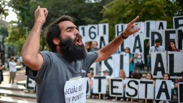man protests against maduro