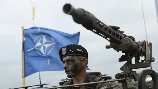 Polish soldier in a tank taking part in Nato military exercises