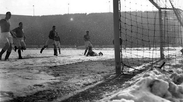 Blackpool score their first goal against Chelsea on a snow-covered pitch at Stamford Bridge in March 1947