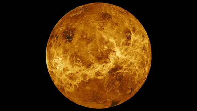 Venus, with a number of dark ridges and brighter features