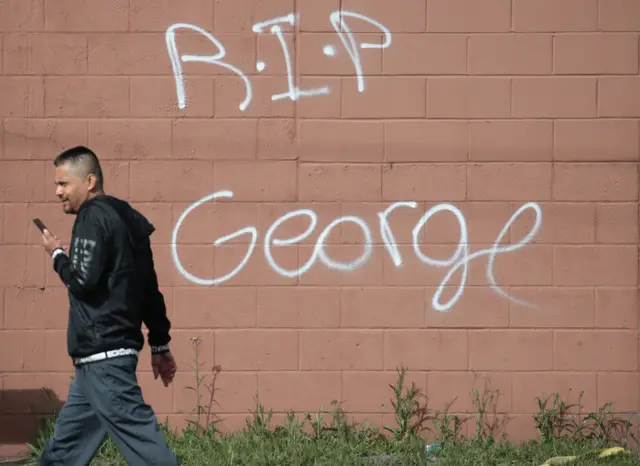 A wall is spray-painted RIP George