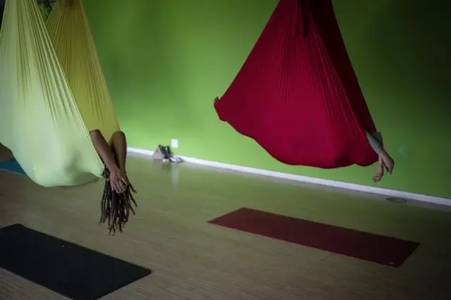 Yogis practice Aerial Yoga at the Earth Yoga Studio in Johannesburg, South Africa, 12 November 2021