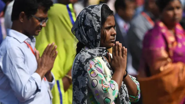 Catholics pray at the Mass in Dhaka