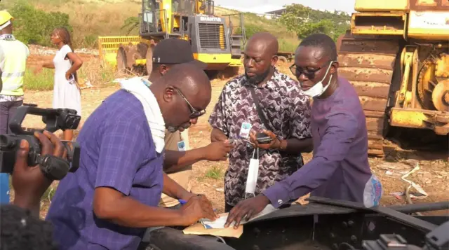 some agents of political parties signing the destruction certificate