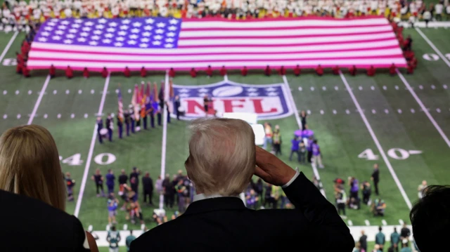 Trump salute as Jon Batiste sing di national anthem