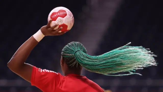 Azenaide Carlos of Angola's Handball team holds the ball.