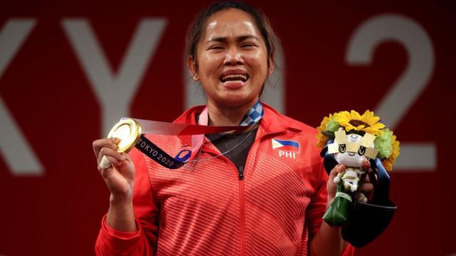 Filipino weightlifter Hidilyn Diaz celebrates her win at the Tokyo Games